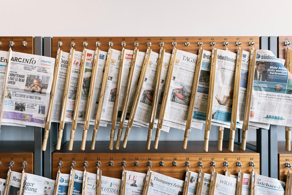 Newspapers hung up ready for reading