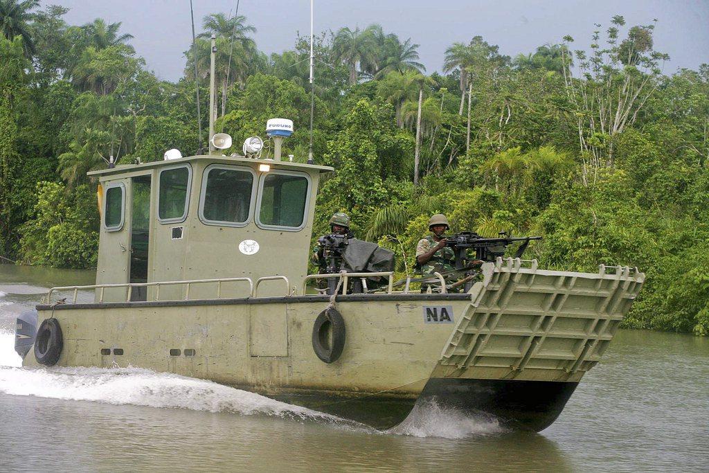Police on a boat in Nigeria