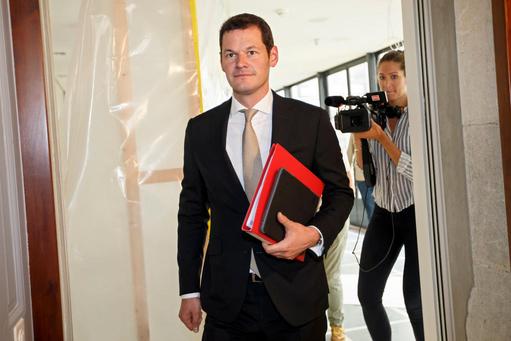 Pierre Maudet enters a press conference in Geneva on September 5