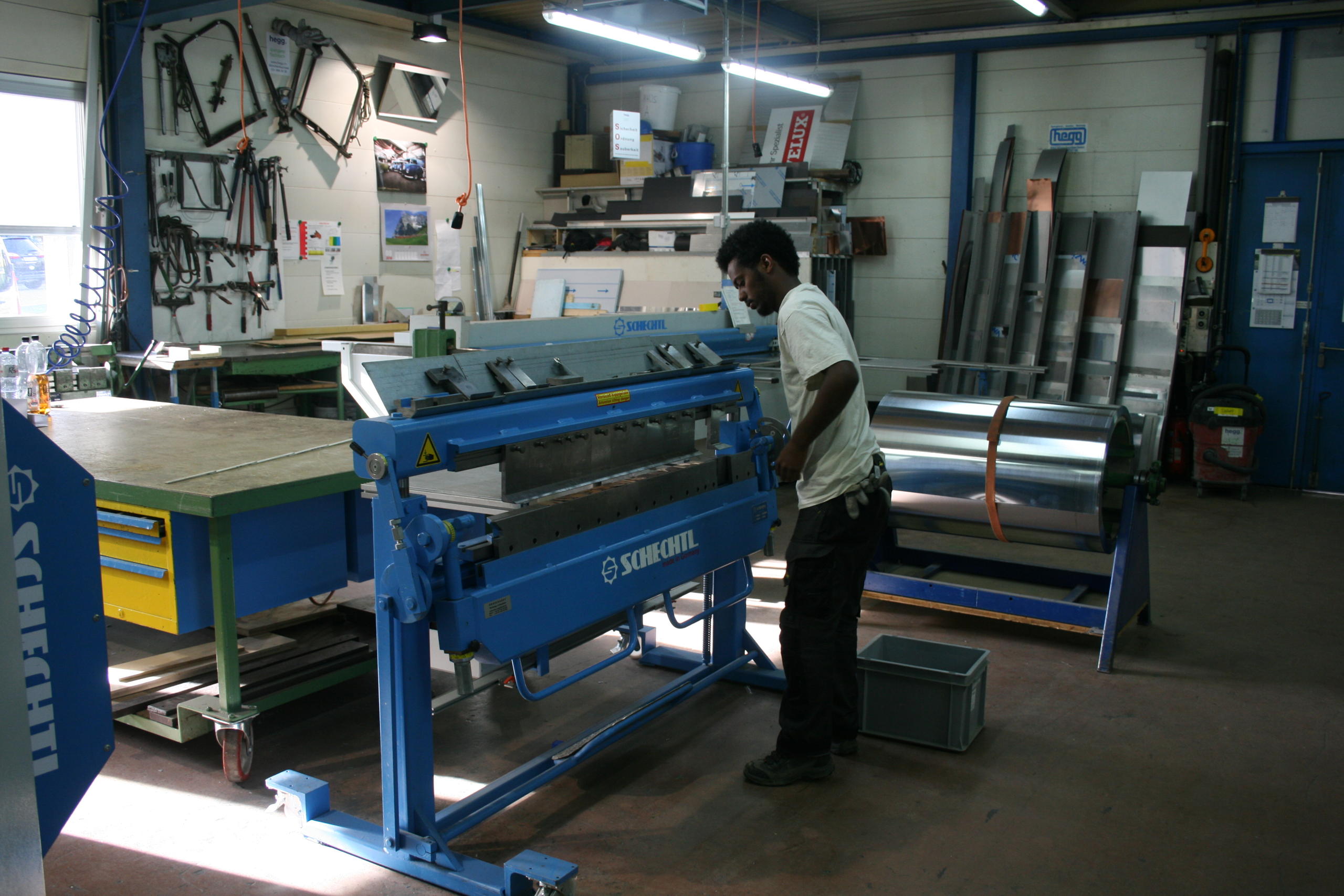 Soloman working at print press