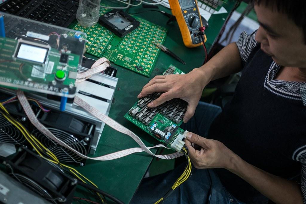 A worker assembles computers