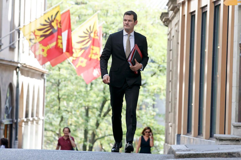 pierre maudet, walking on a street in Geneva