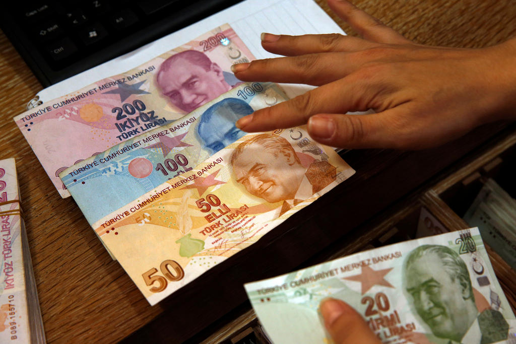 Turkish lira banknotes bearing pictures of modern Turkey s founder Mustafa Kemal Ataturk