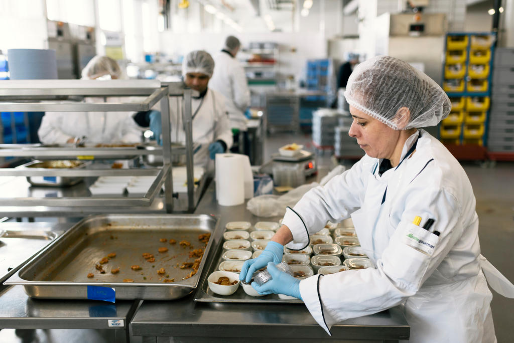 caterers working in a kitchen