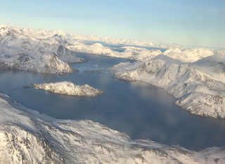 Aerial view of Greenland with snow-capped mountains