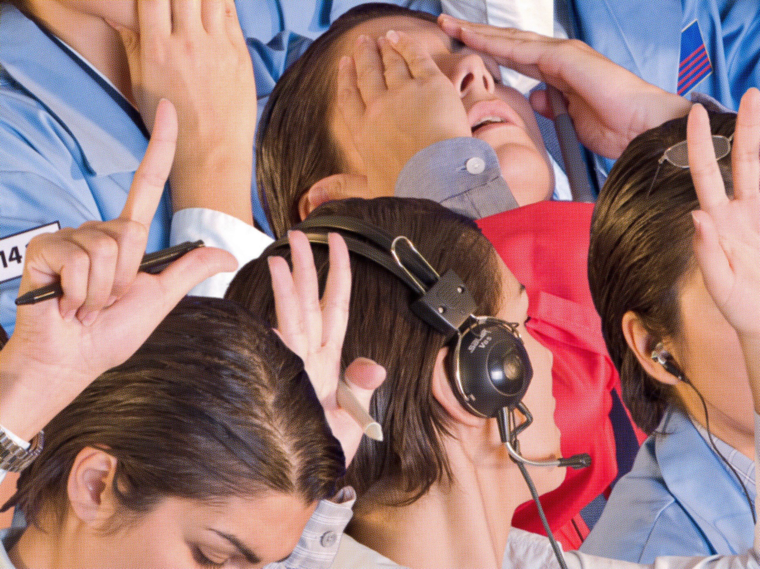 Photo of peoples heads and hands