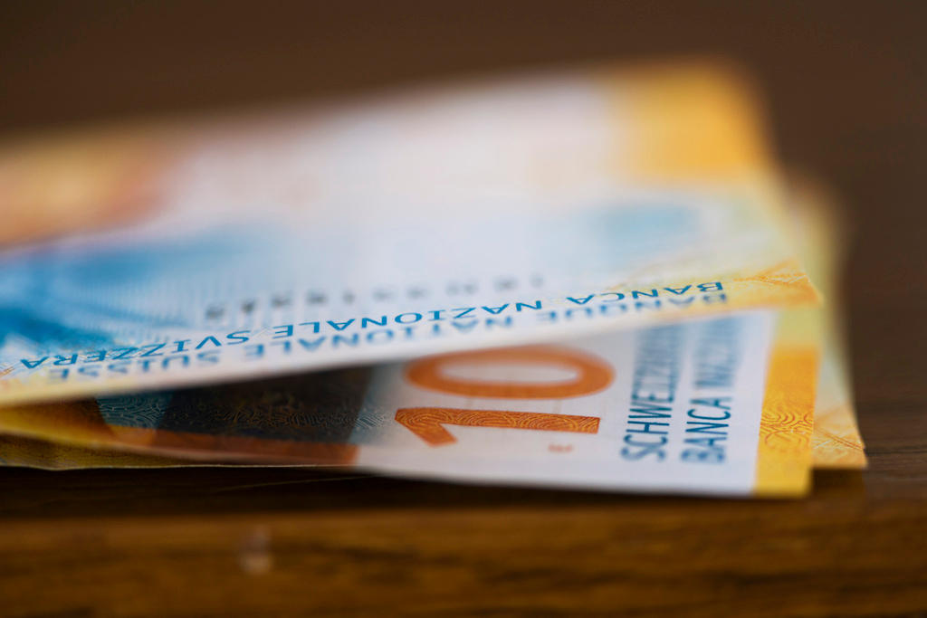 Detail view of a few ten Swiss franc bills
