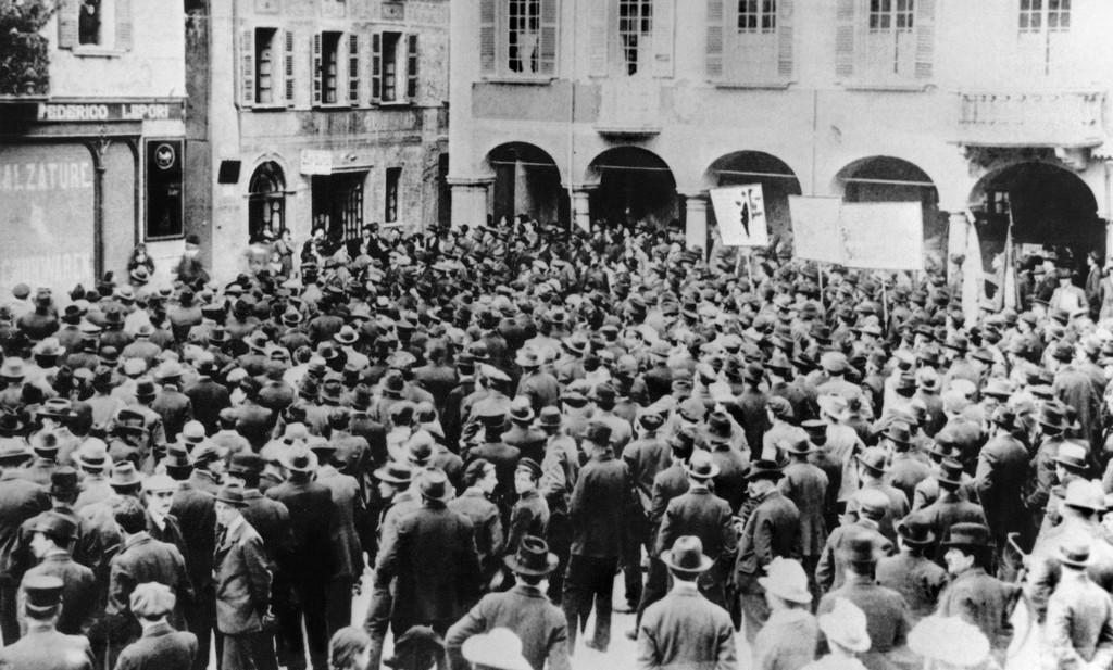 Striking workers gather in a town square in Bellinzona during the General Strike