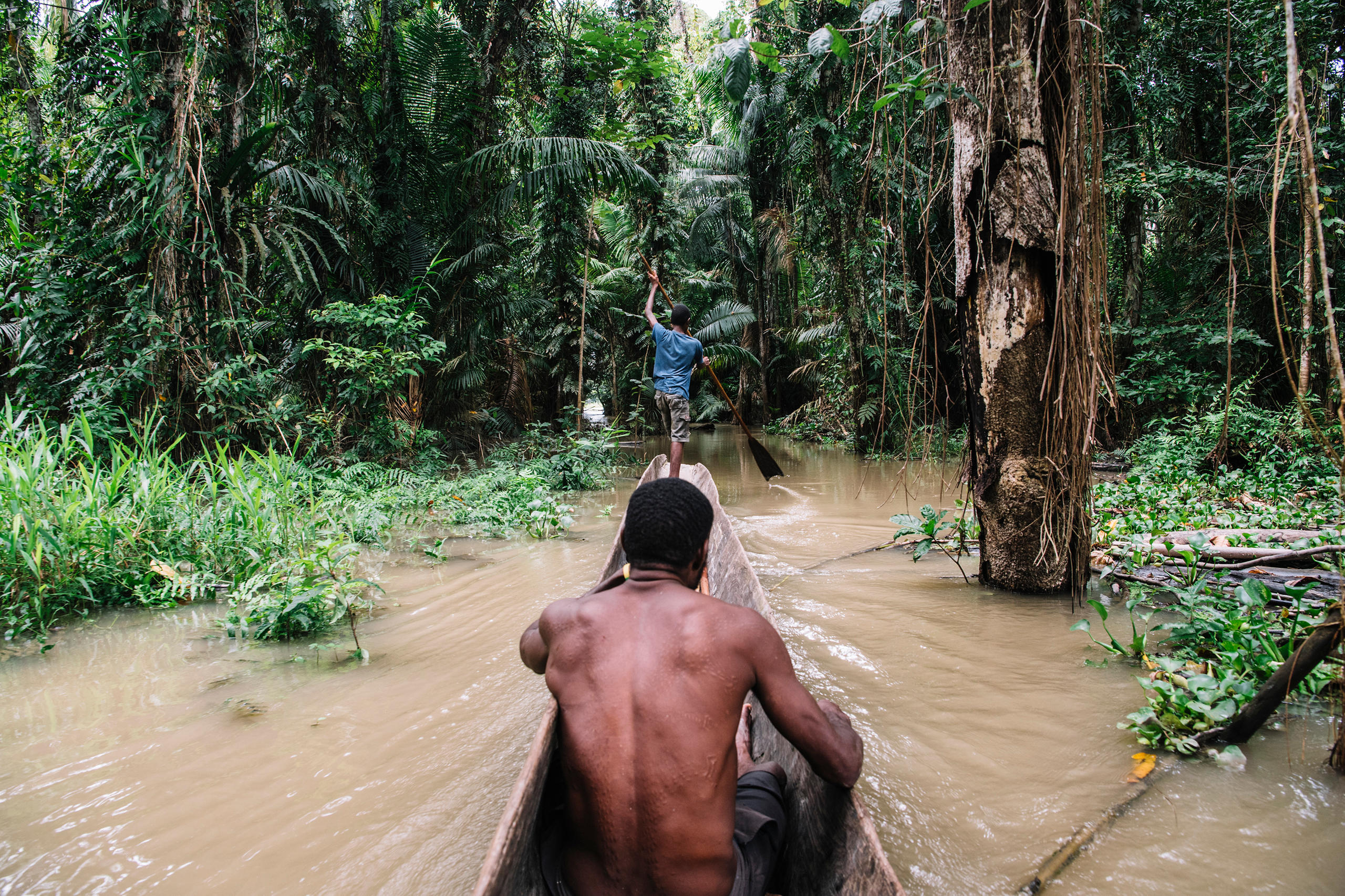 Two men during crocodile hunt in Papua New Guinea