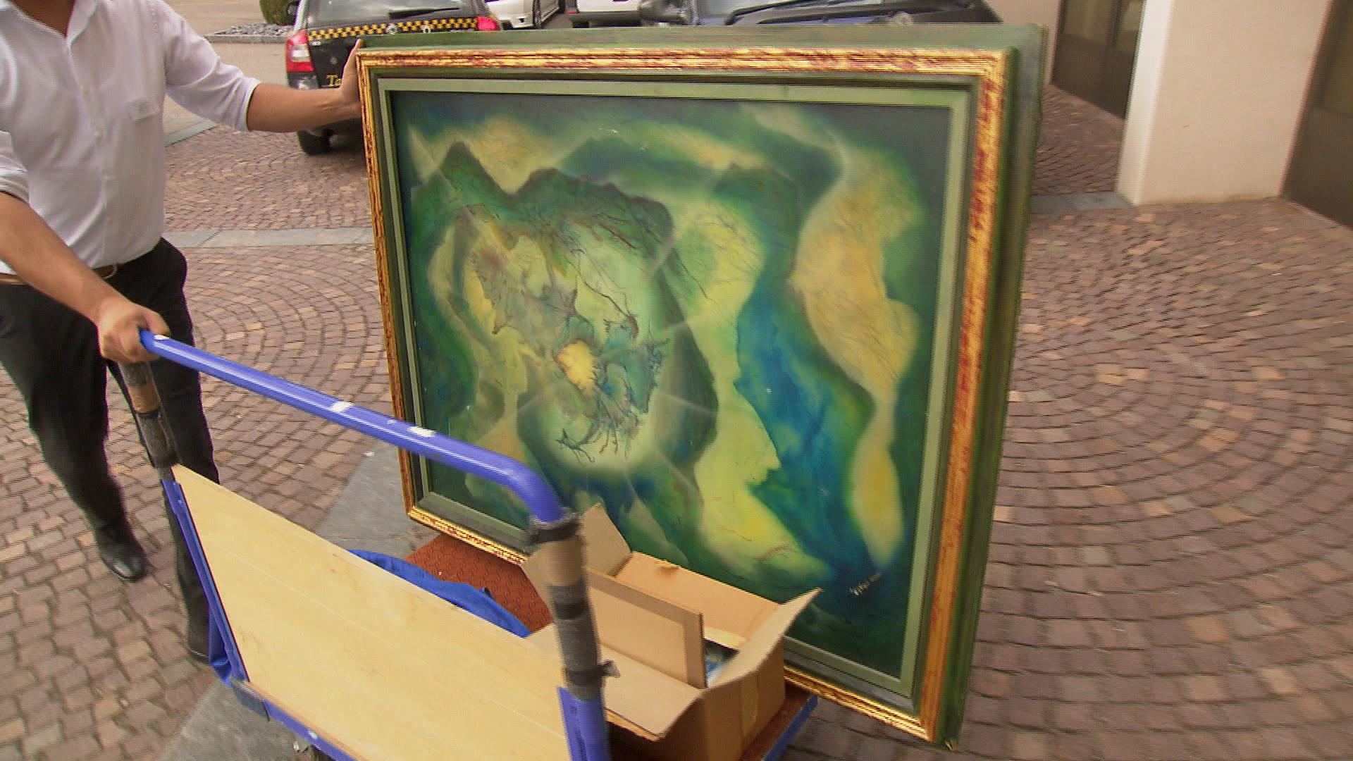 A painting being carried away.