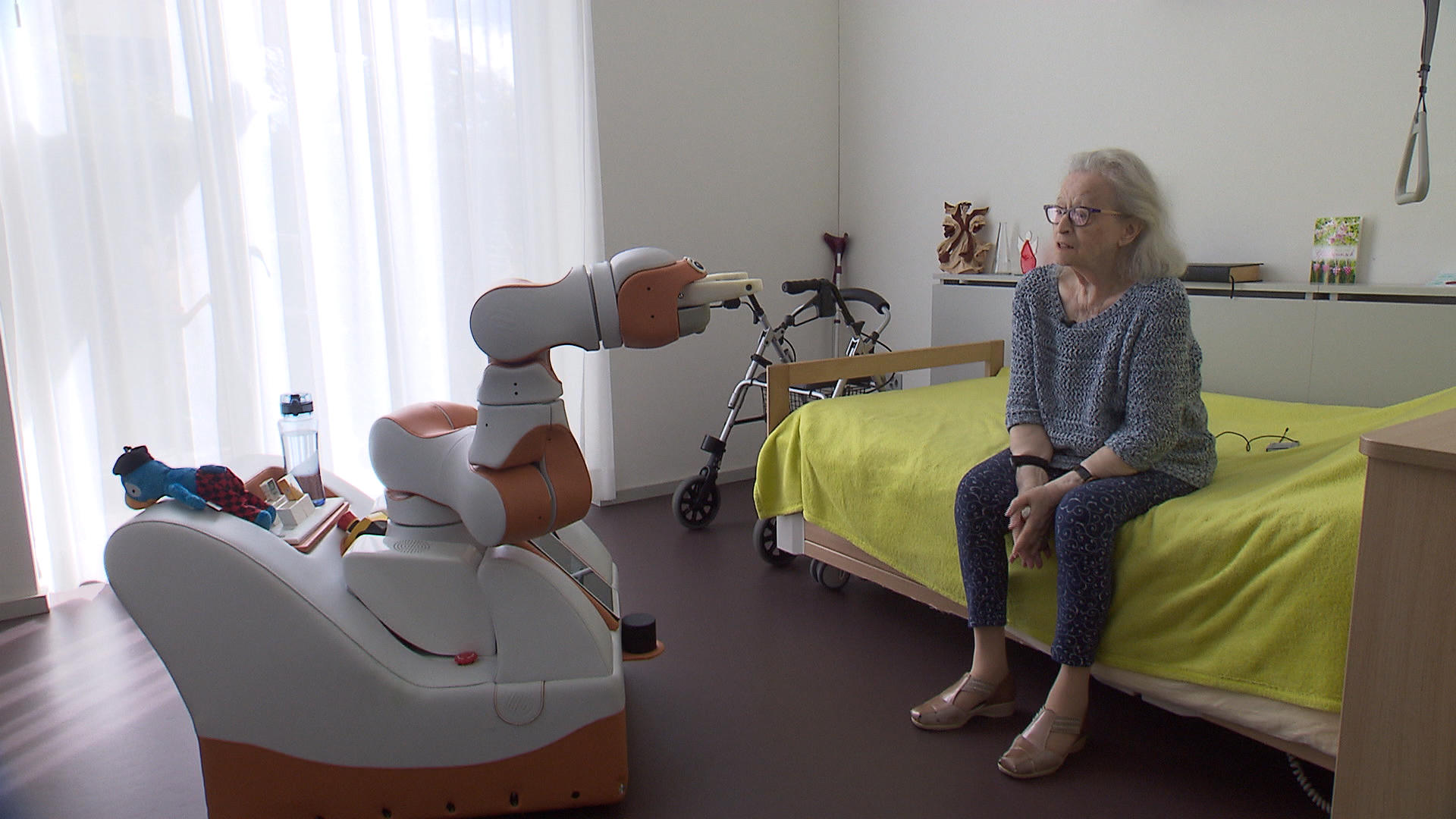 Robot with old woman