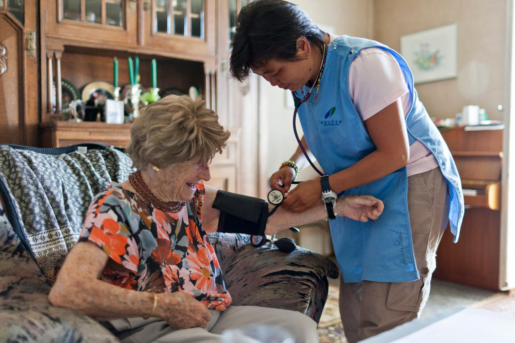 Old woman and nurse at home