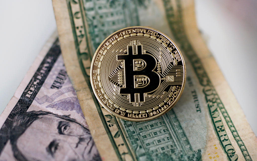 Bitcoin and dollar notes
