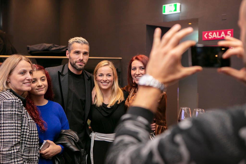 Behrami and Gut pose along with other people for the cameras