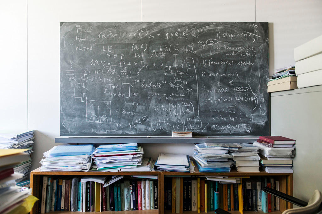A chalkboard covered in equations at an office at CERN