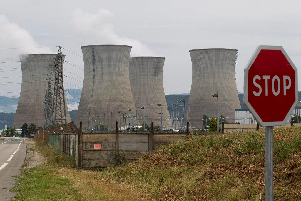 Bugey nuclear plant with Stop road sign in foreground