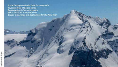 card with view of Swiss mountain