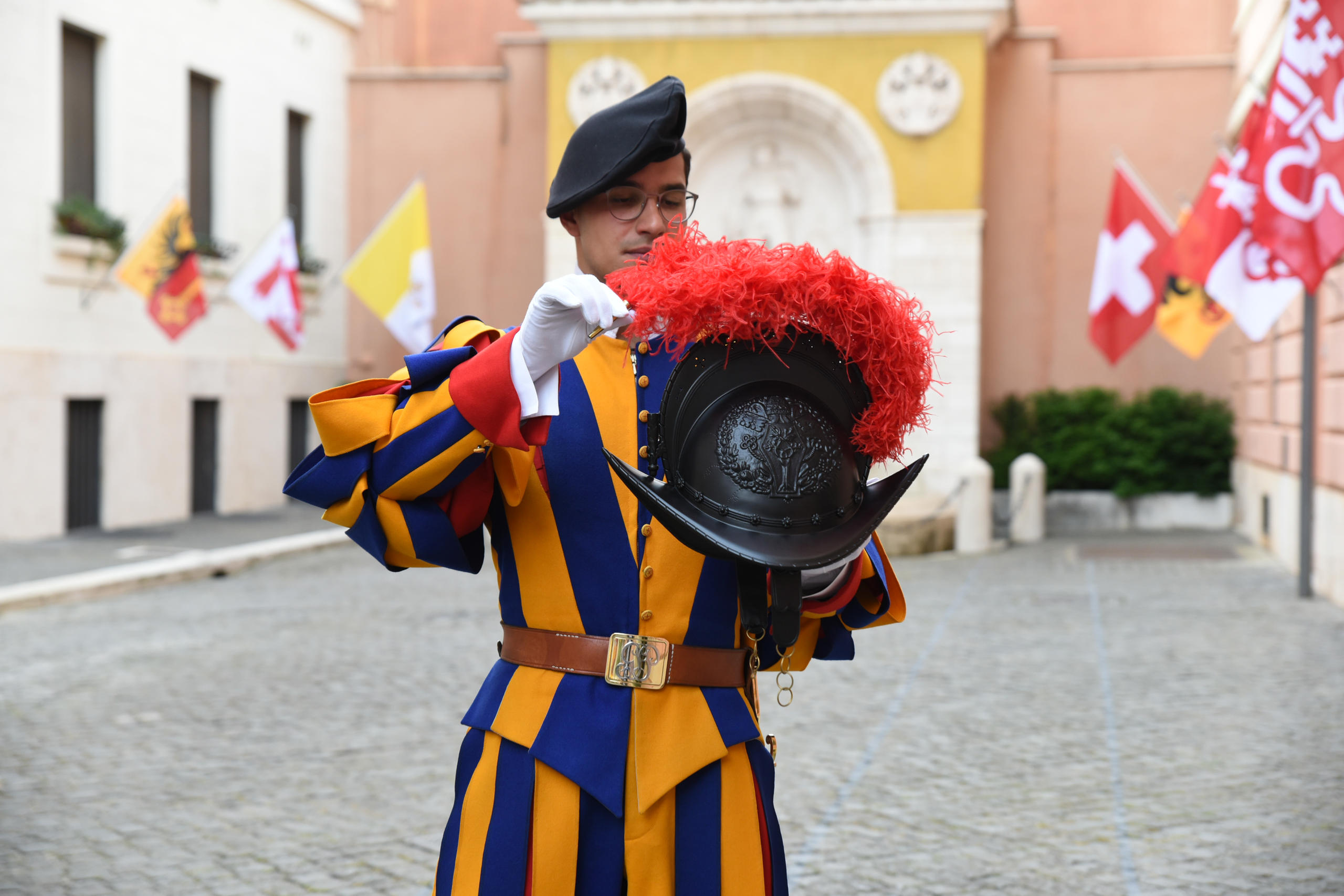 A Swiss guard inspects the new helmet