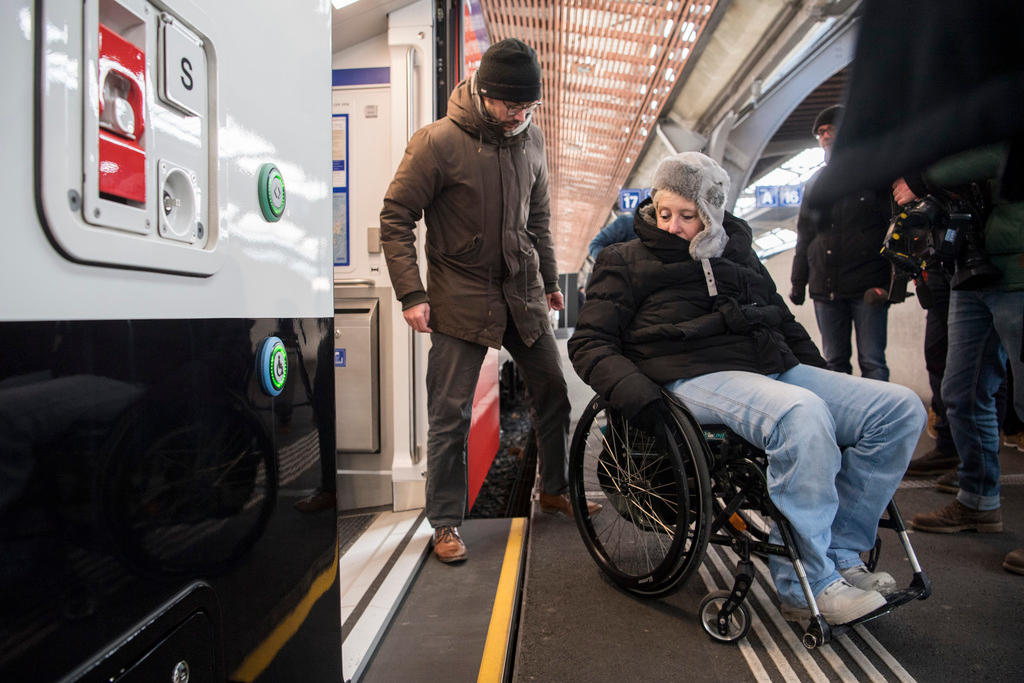 Wheelchair user getting off a train