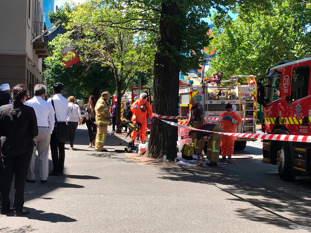 Fire crews work outside the Indian and French consulates in Melbourne