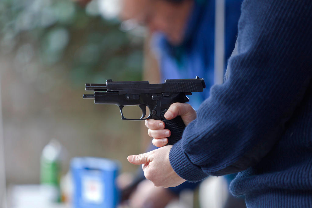 A man loads a pistol