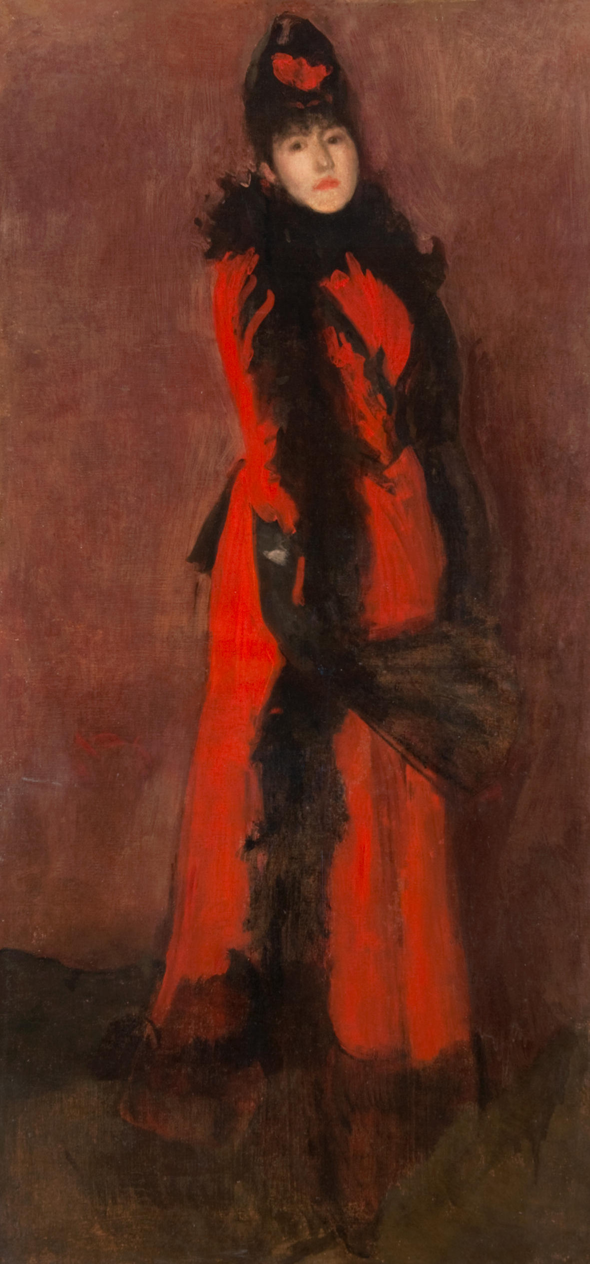 Mujer vestida en rojo y negro con abanico