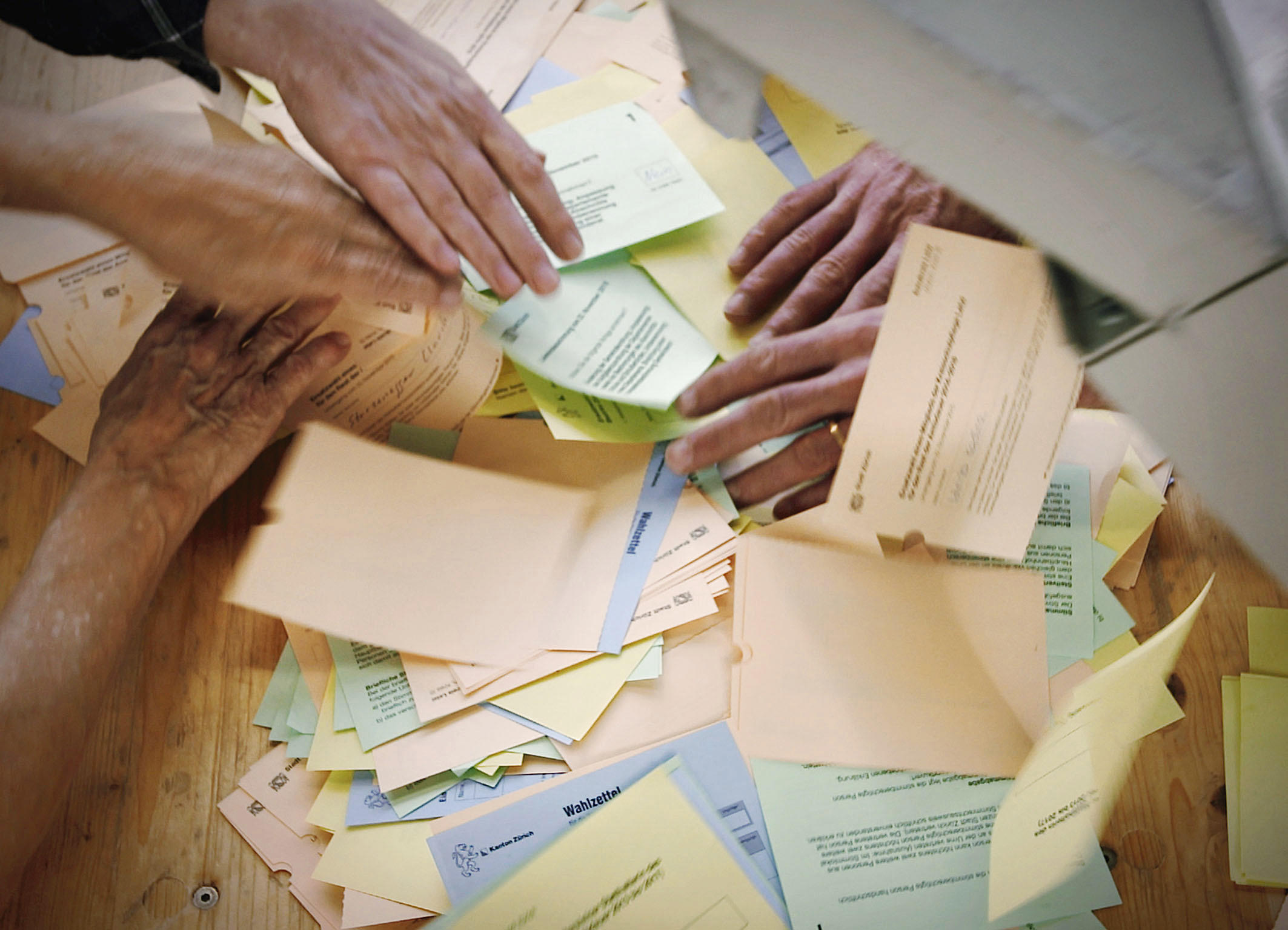 hands and slips of paper