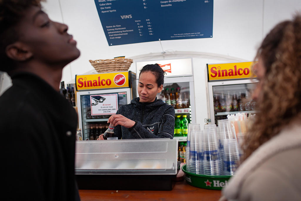 woman serves at a ski resort