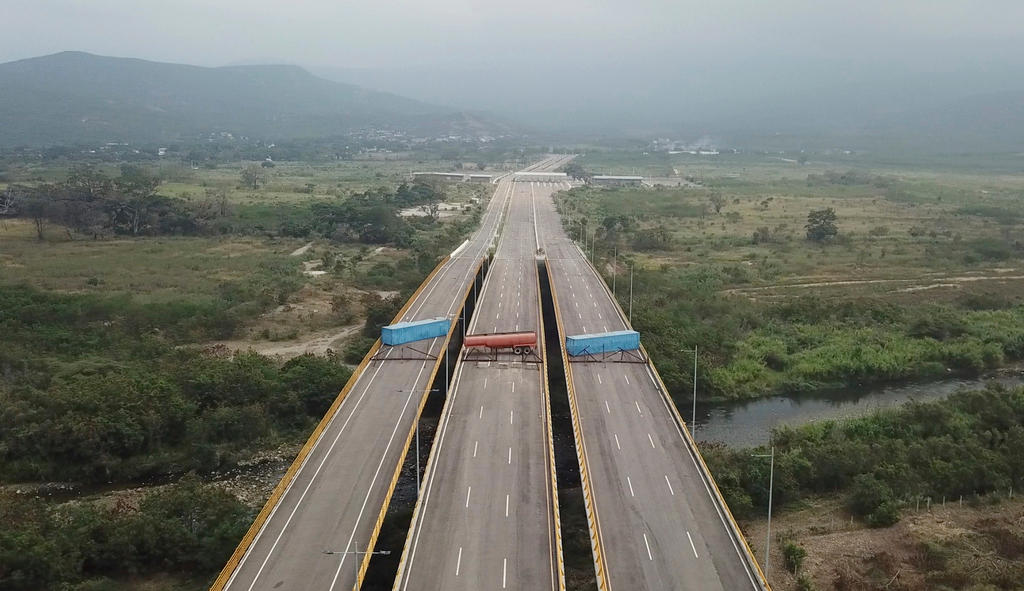 Venezuelan troops have barricaded a bridge on the country’s western border with Colombia
