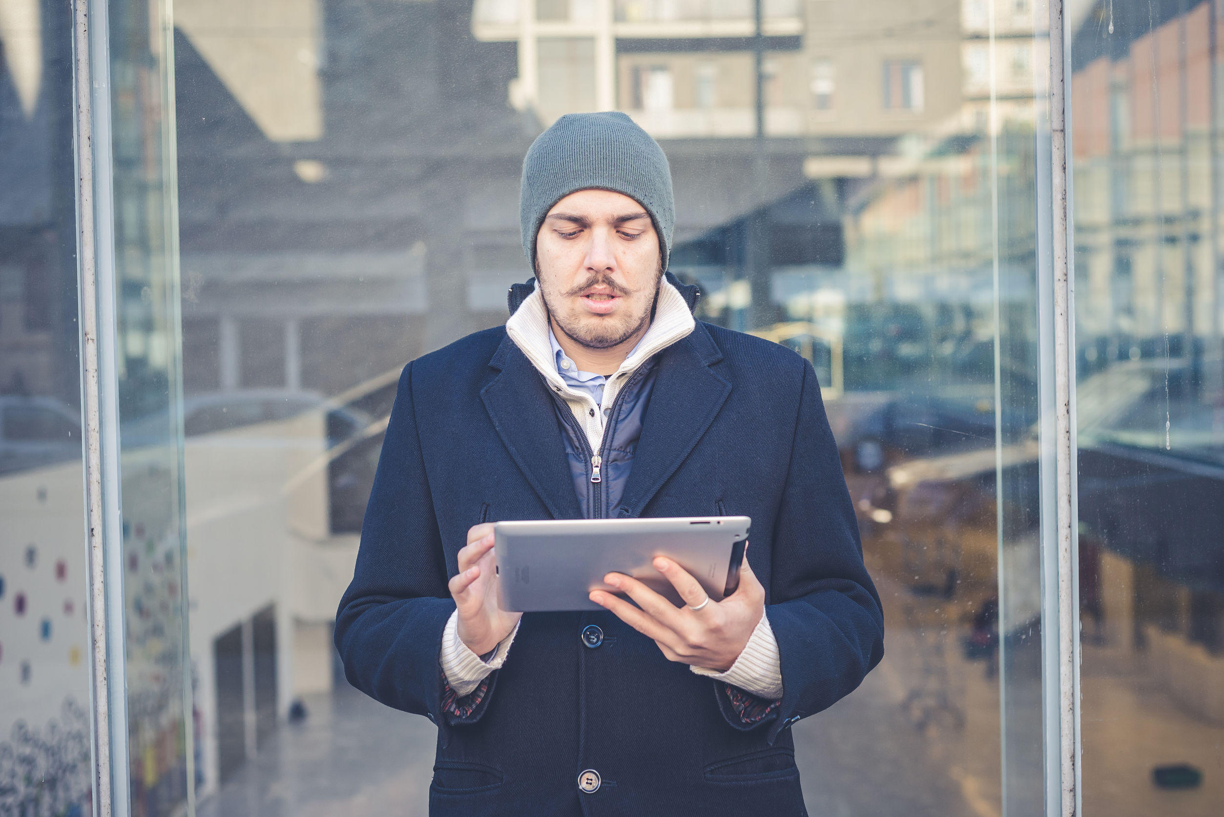 Man reading ipad