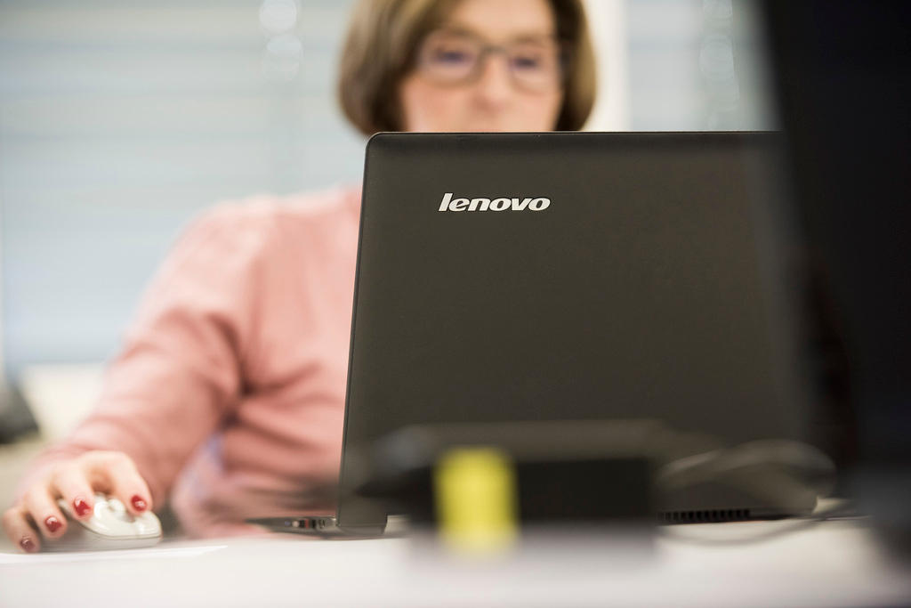 woman looking at computer screen