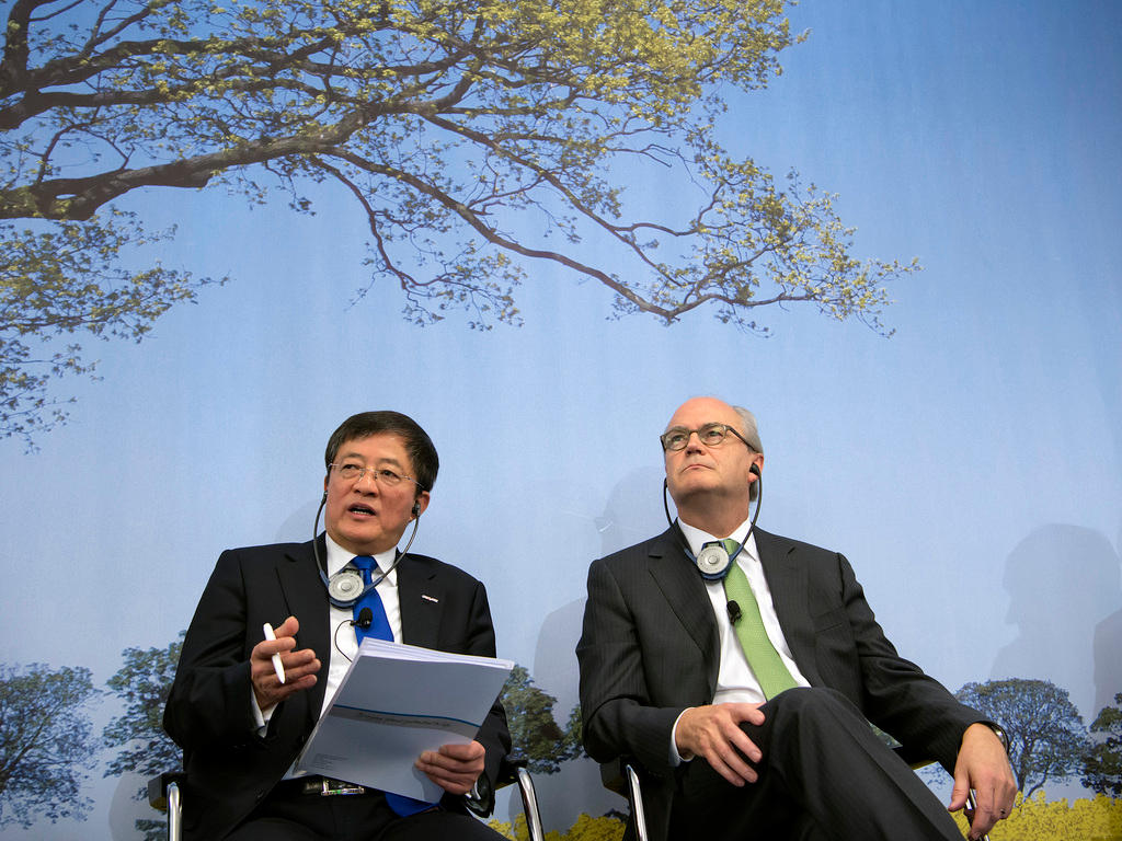 Former ChemChina chairman Ren Jianxin and Michel Demare of Syngenta in 2016