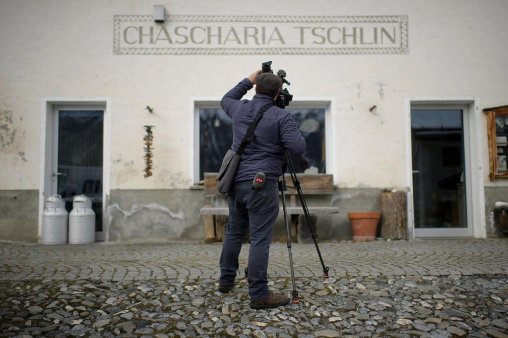 Cameraman in a village