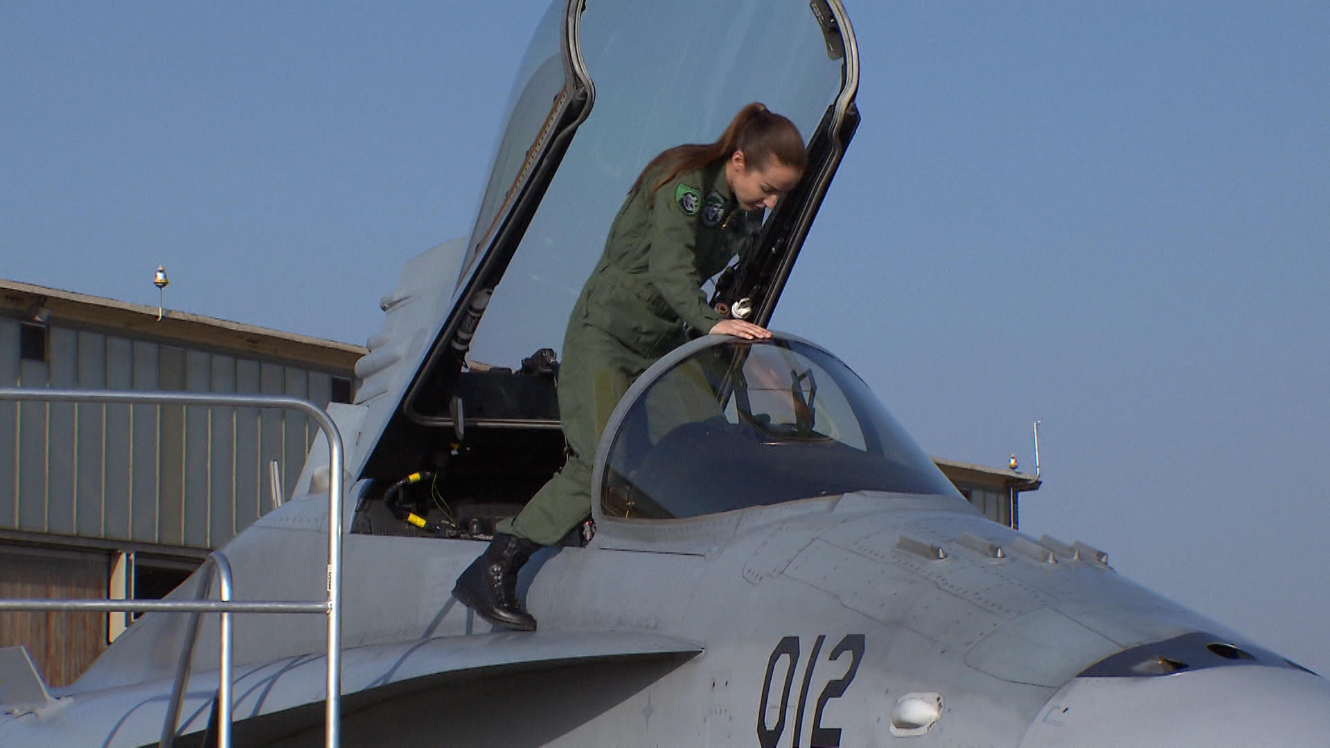 Fanny Chollet climbs into FA18 jet fighter