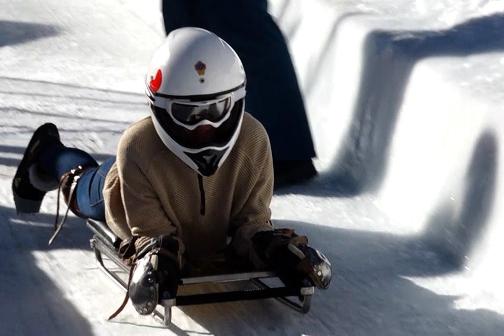 woman tobogganing