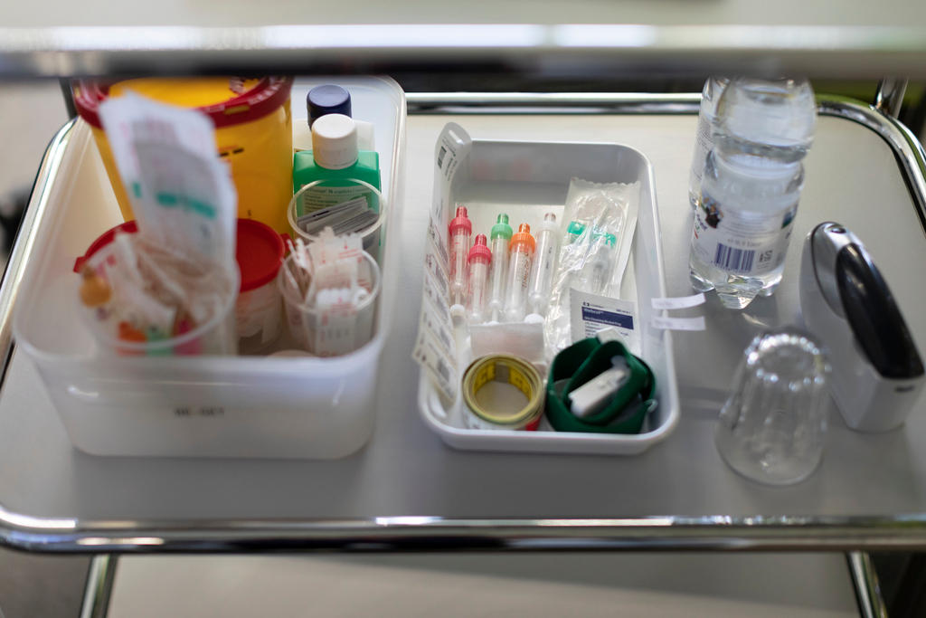 Syringes and other items on a hospital trolley