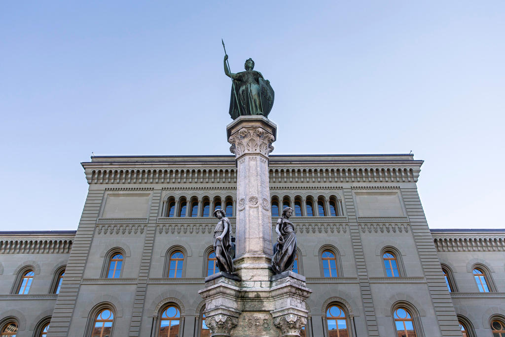 Fountain with statue in front of Swiss foreign ministry