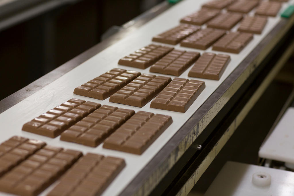 chocolate on a conveyer belt in factory