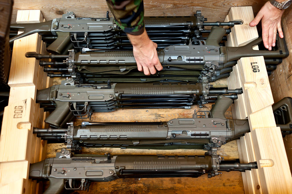 Hands selecting guns