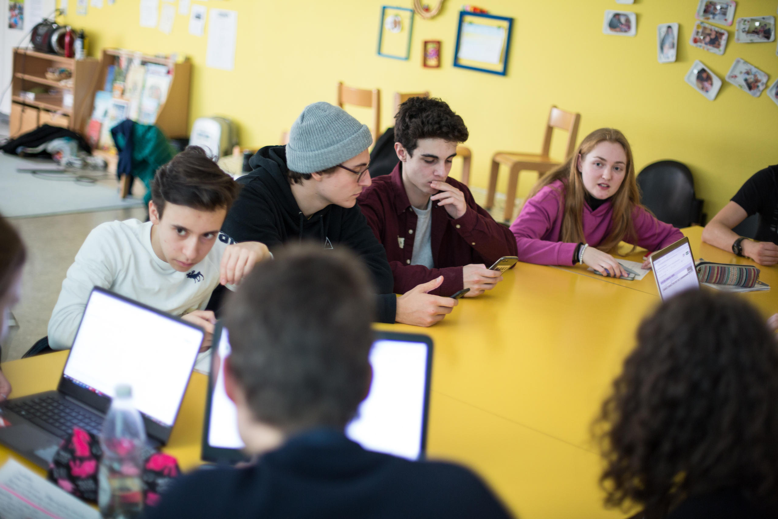 Young people debating in a classroom