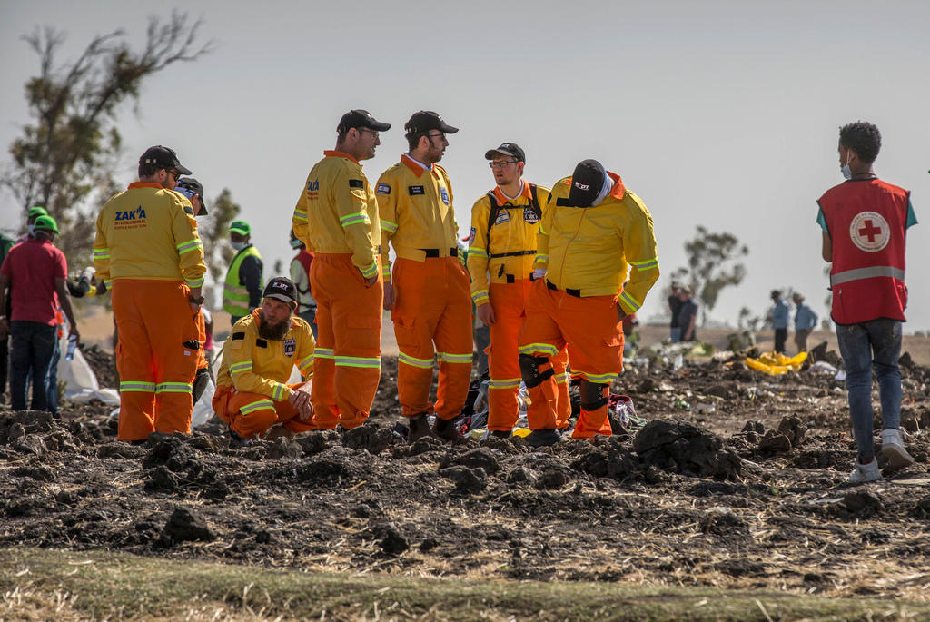Investigators at the Ethiopian crash site