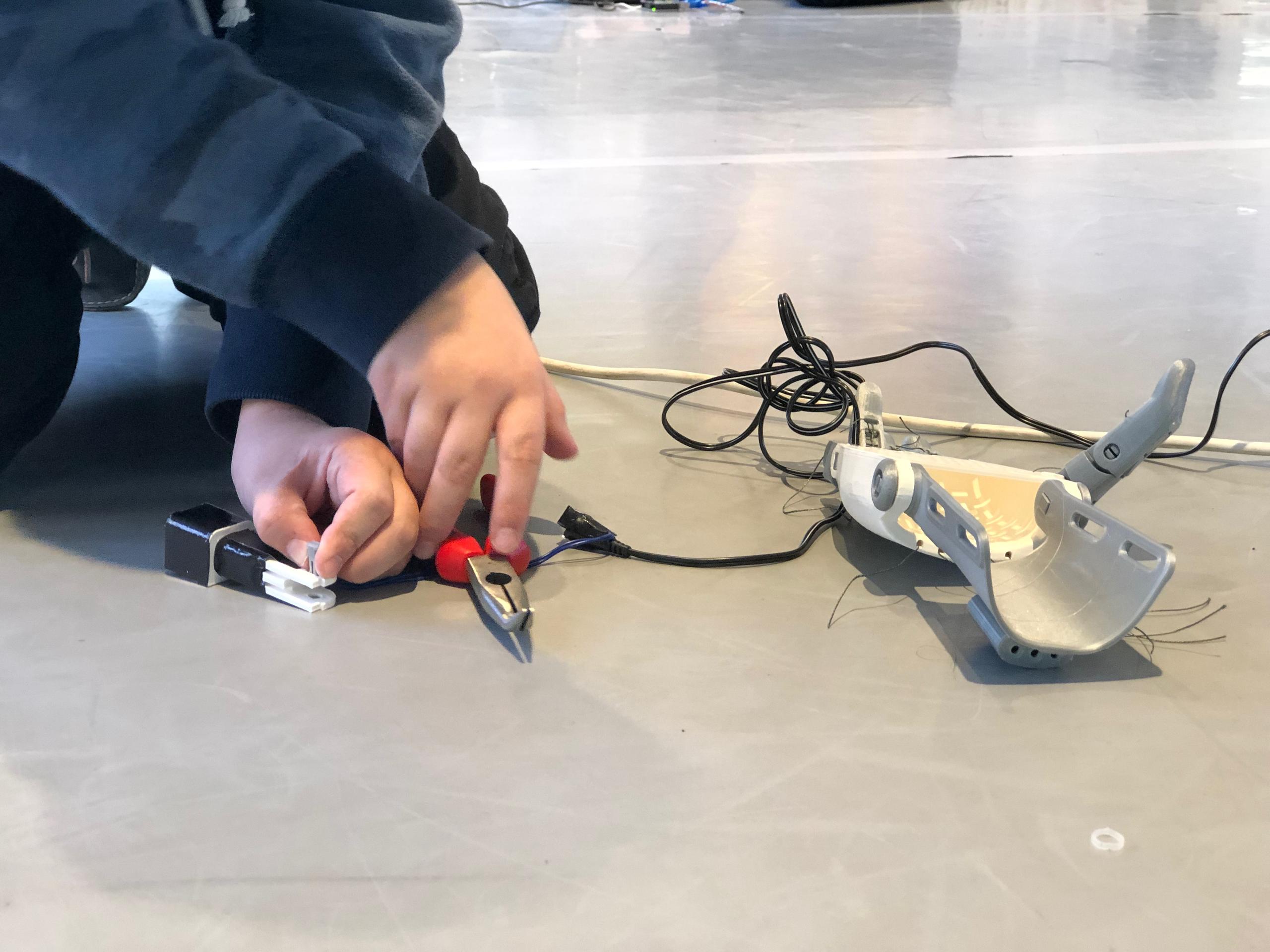 boy working on robot hand