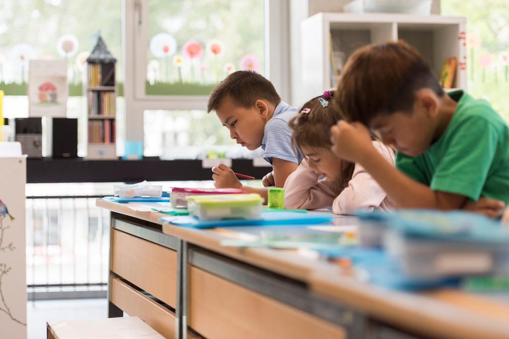 three children in classroom