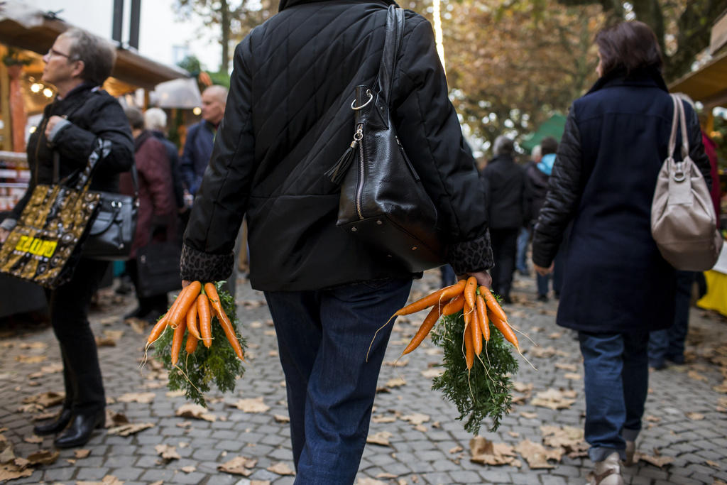 Woman carrying carrots