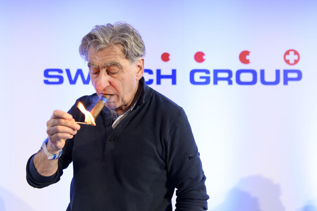 Swatch CEO Nick Hayek smokes a cigar