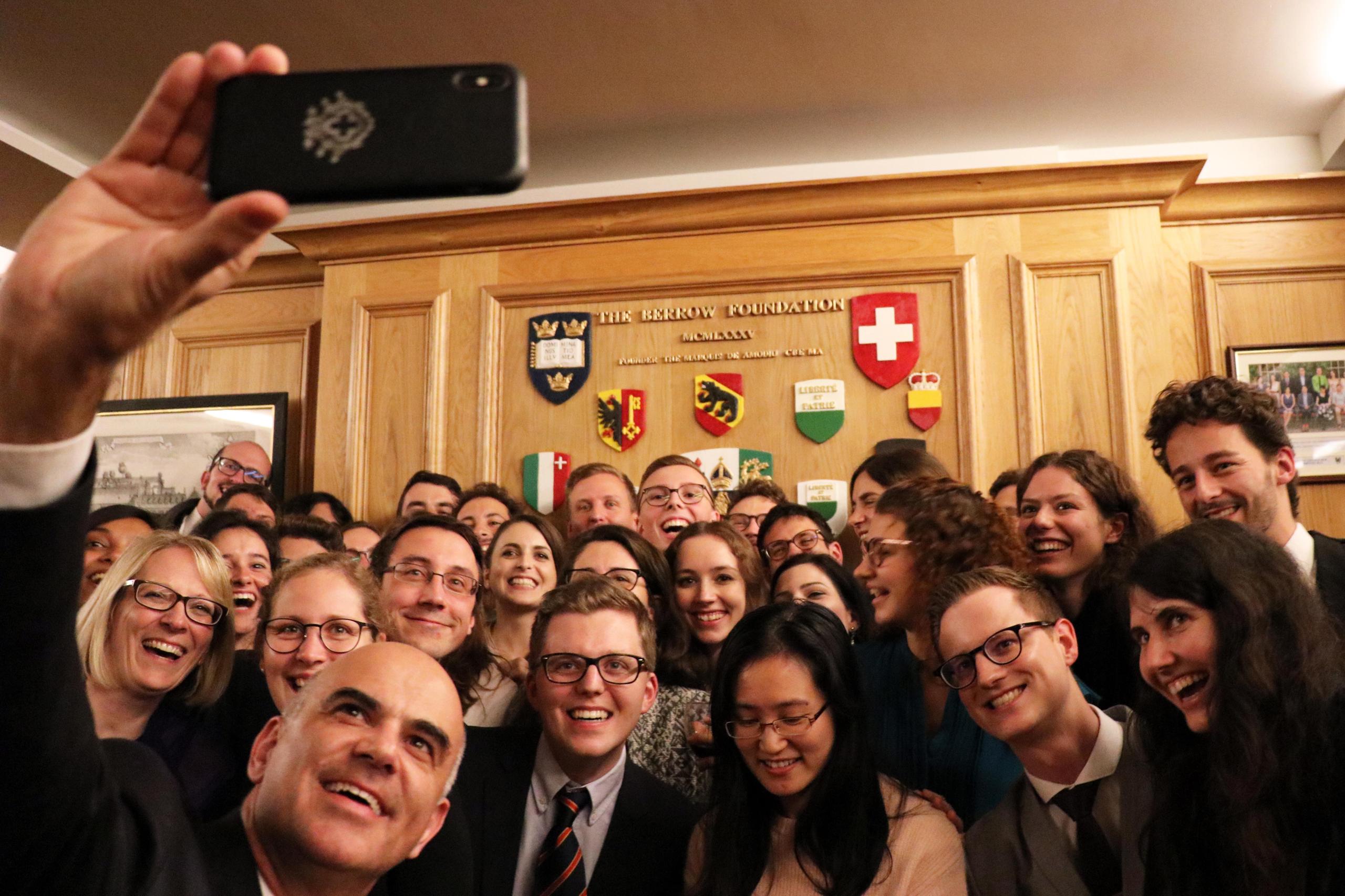Alain Berset taking a selfie with Swiss students in Lincoln College, Oxford