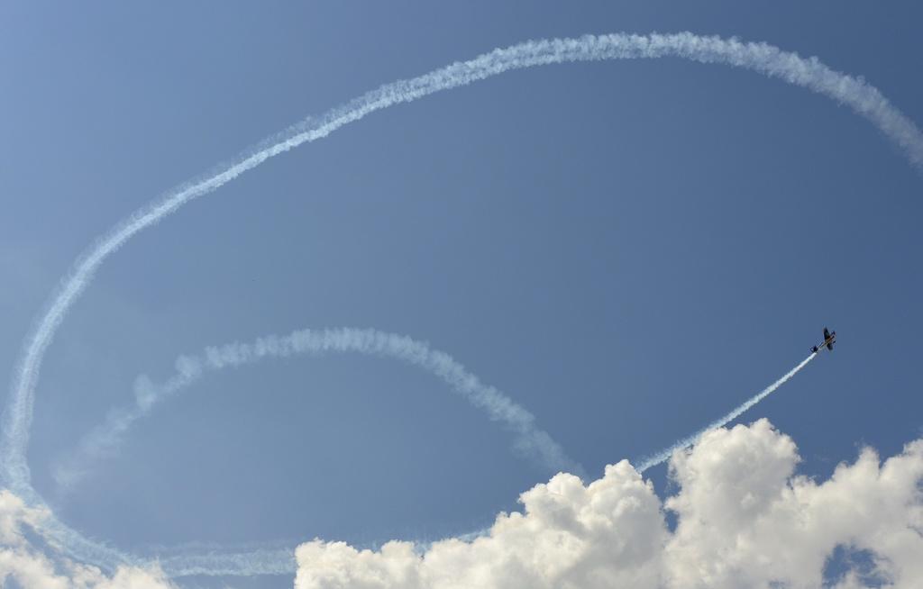 Plane looping in the sky during an air show