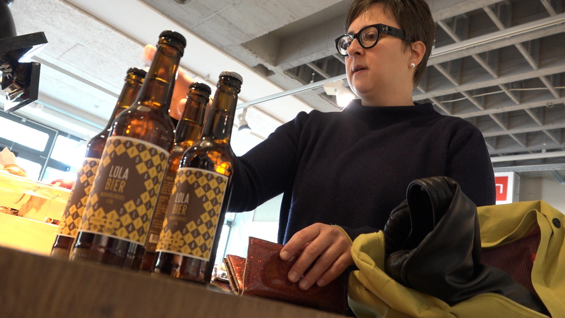 Lady buying organic beer