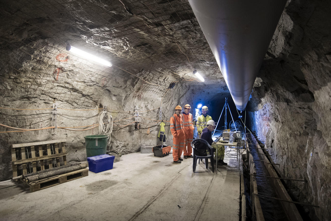 Workers in an underground tunnel