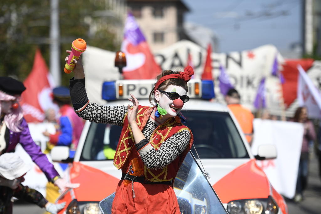 May Day protester in Zurich dressed as a clown